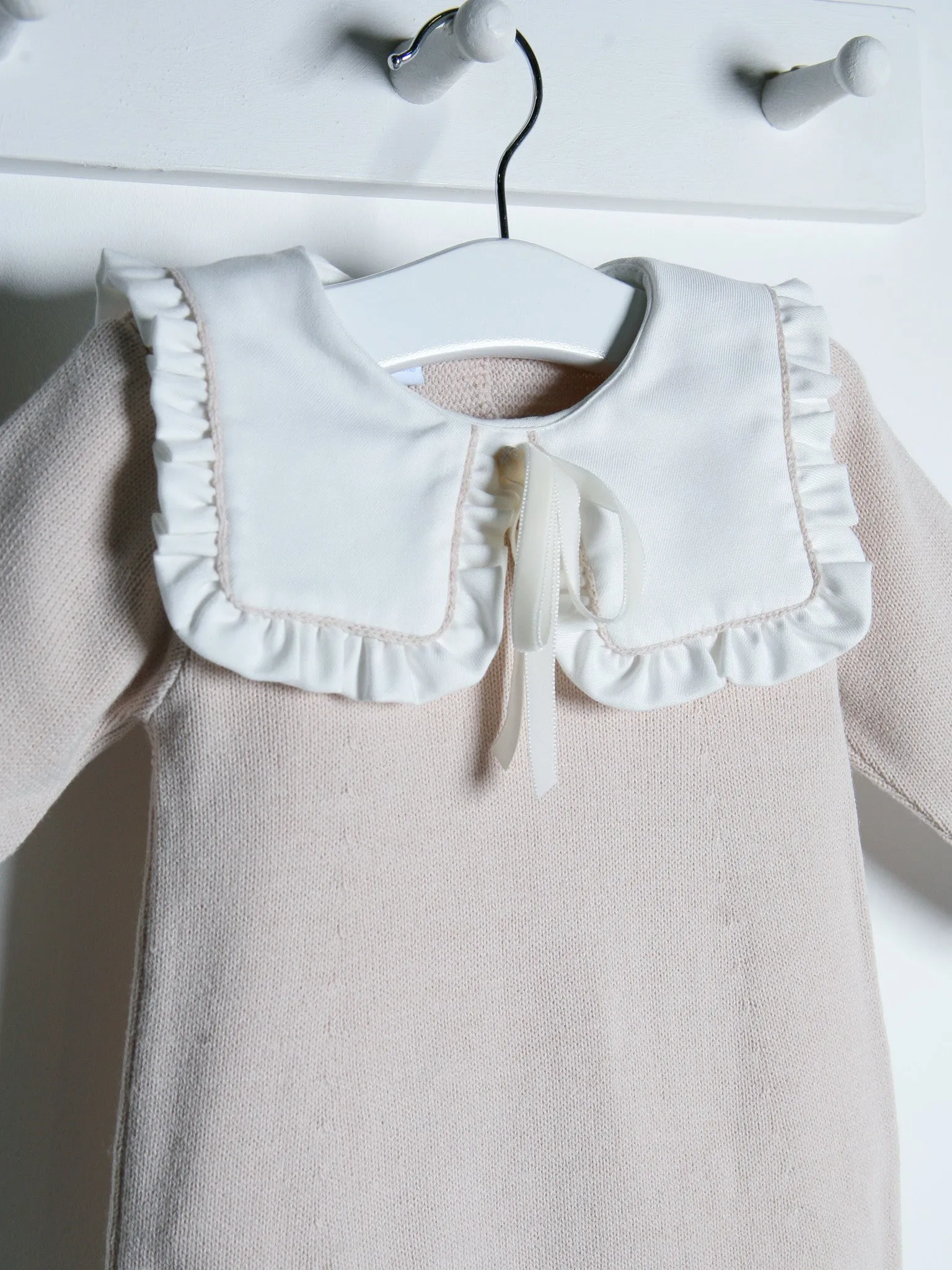 Baby Mabel beige knitted romper with bib collar