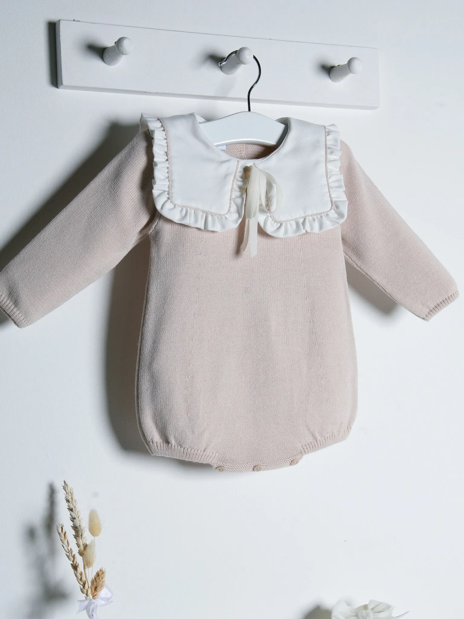 Baby Mabel beige knitted romper with bib collar