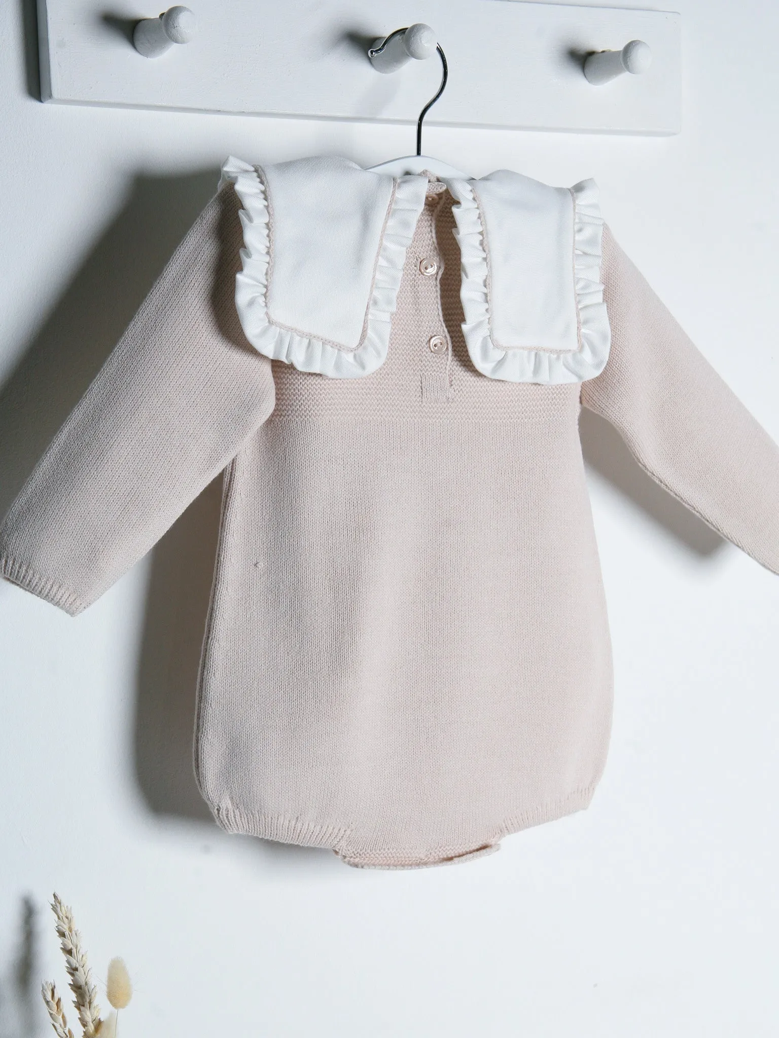 Baby Mabel beige knitted romper with bib collar